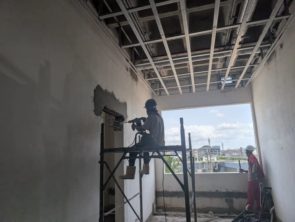 Construction personnel actively carrying out interior site works
